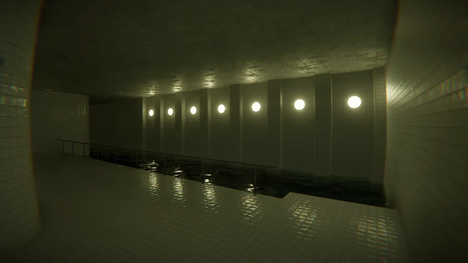 An atmospheric view of an indoor swimming pool at night, with a row of circular lights along the wall creating a rhythmic pattern of reflections on the dark water surface. The white tiled walls and floor gleam subtly under the artificial lighting, which casts a moody ambiance across the pool area. The pool itself is still, suggesting a quiet and empty space, evoking a sense of calm and solitude.